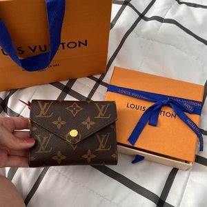 Lv real authentic wallet it is in graved with my initials M&M